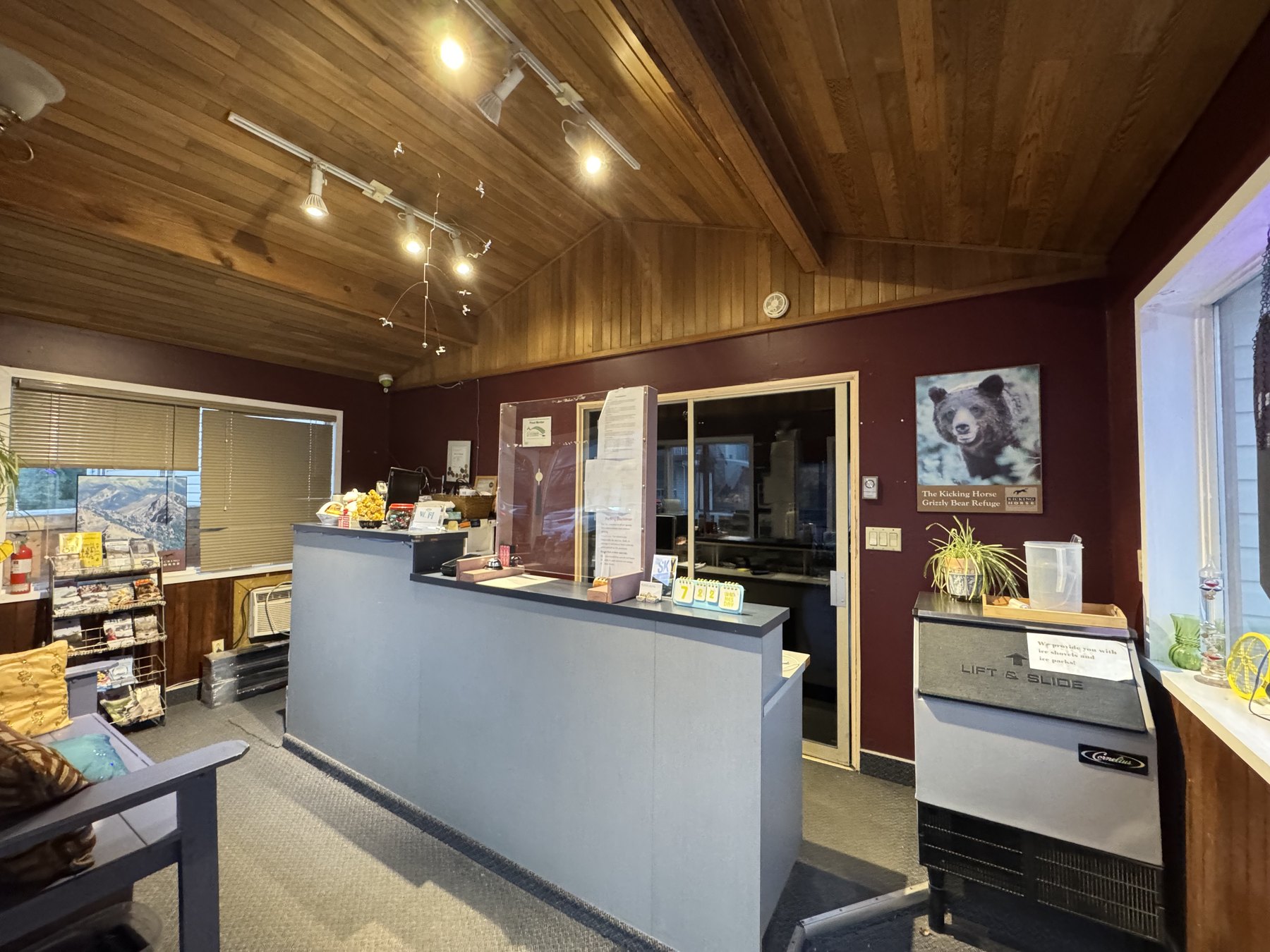 Warm wood-panelled front desk at Rondo Motel